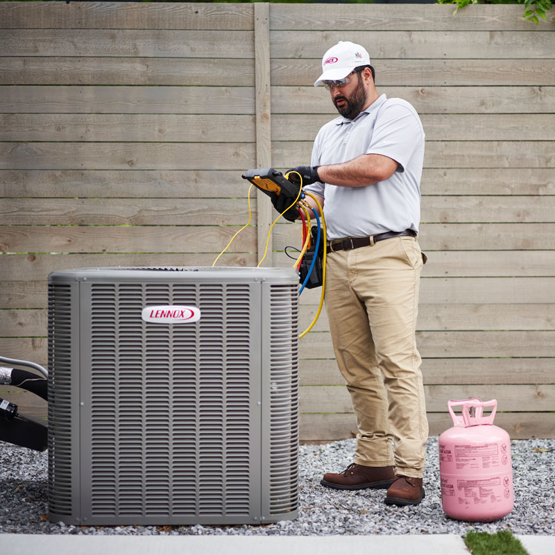 man repairing ac unit